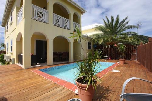 Paradise Properties - Jolly Harbour Yellow House - #318